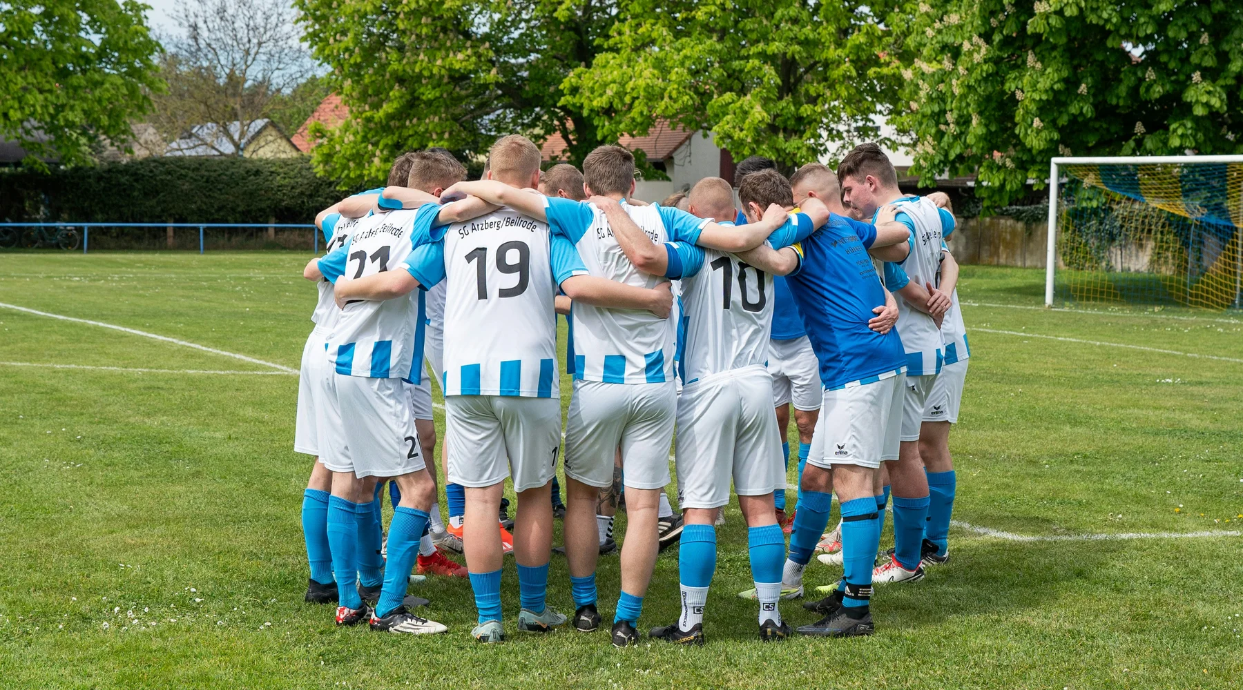 A group of footballers in a huddle