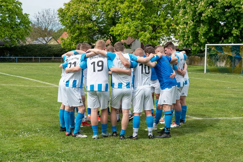 A group of footballers in a huddle